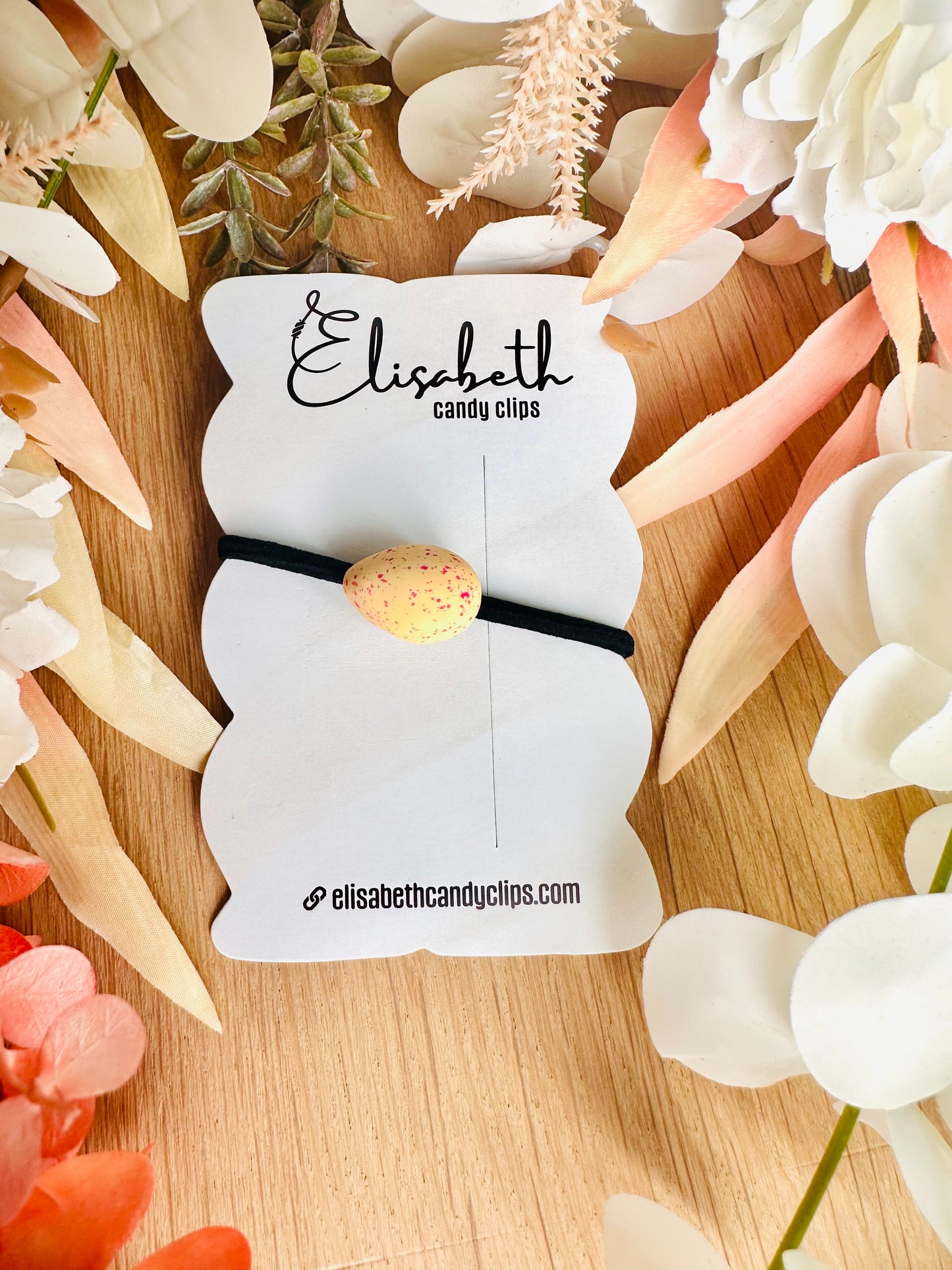 Elastiek paaseitje spikkels zachtgeel